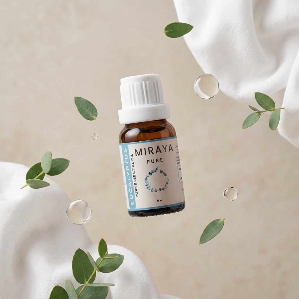 Miraya essential oil bottle with eucalyptus leaves on a beige background