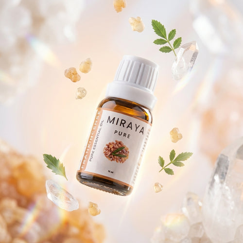 Miraya Pure essential oil bottle with decorative elements on a blurred background