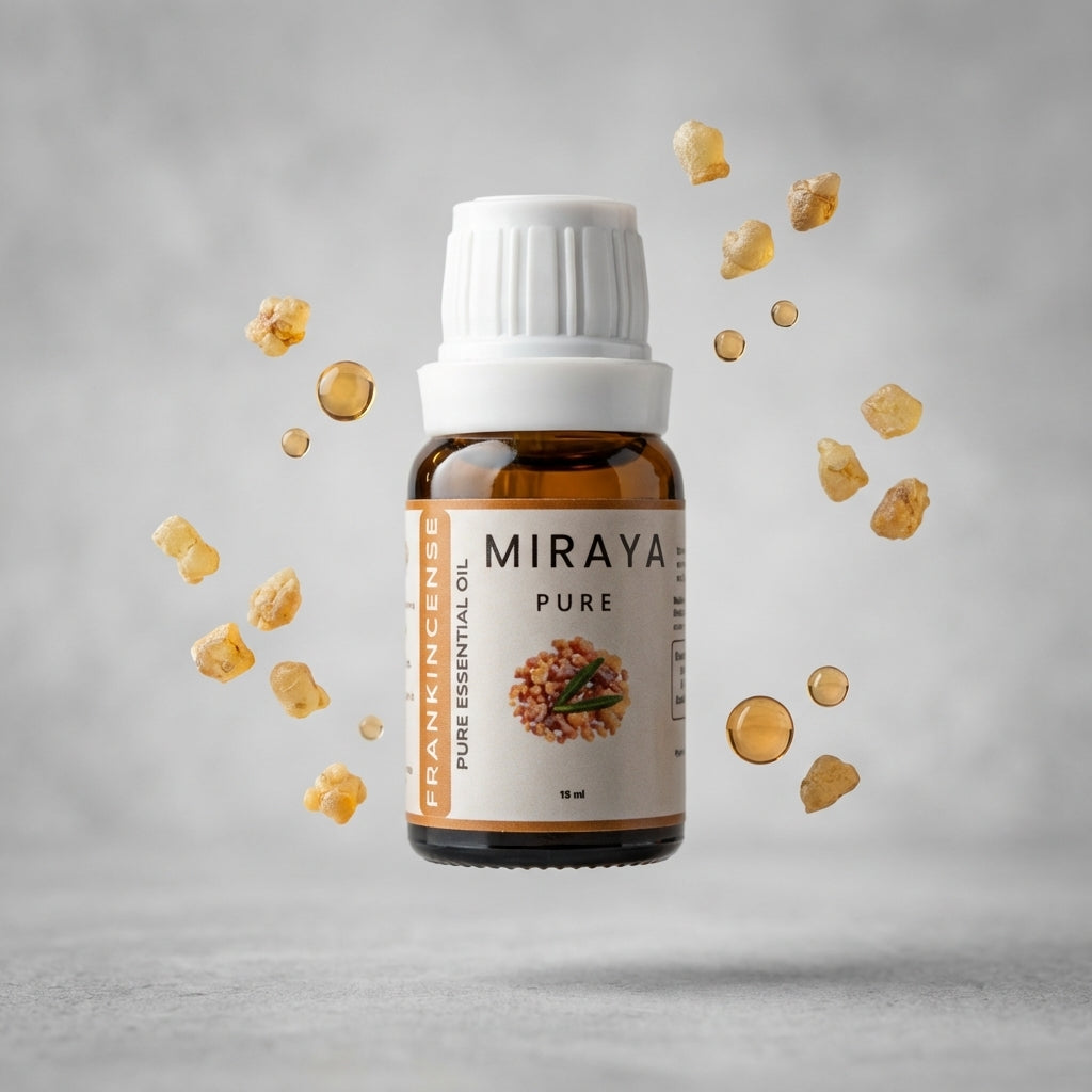 Miraya Pure Frankincense essential oil bottle with incense resin on a gray background