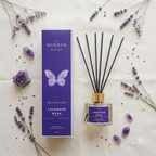 Miraya Blends Lavender Dusk reed diffuser set with a purple box, glass bottle, and black reeds, styled on a cream fabric with lavender sprigs and purple crystals.